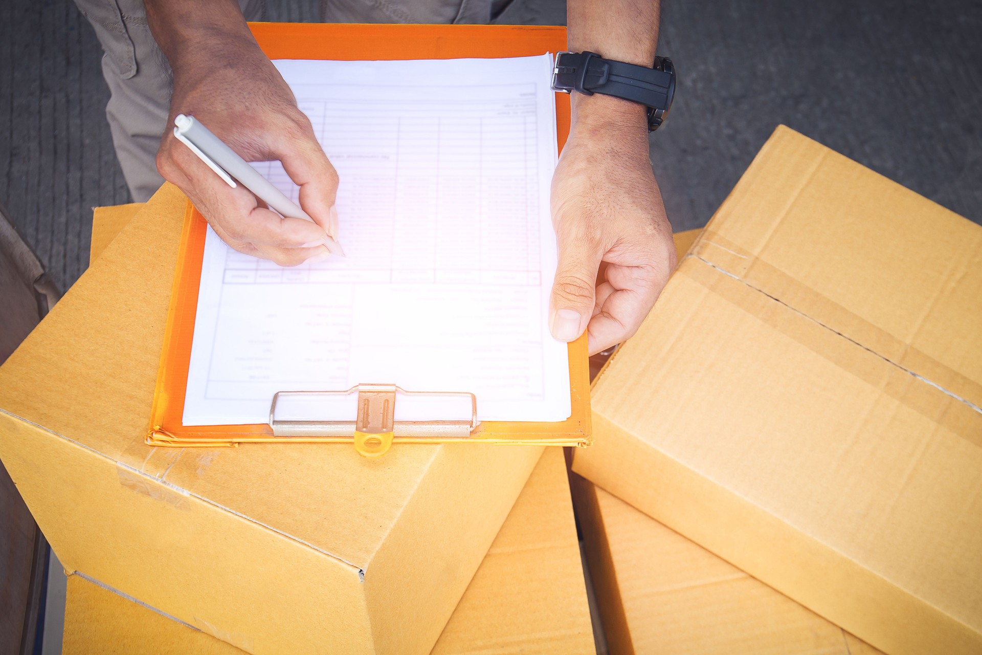 Workers check invoices for shipping to customers. Business e- commerce. Delivery parcels boxes. Supplies shipment. Storehouse shipping logistics.